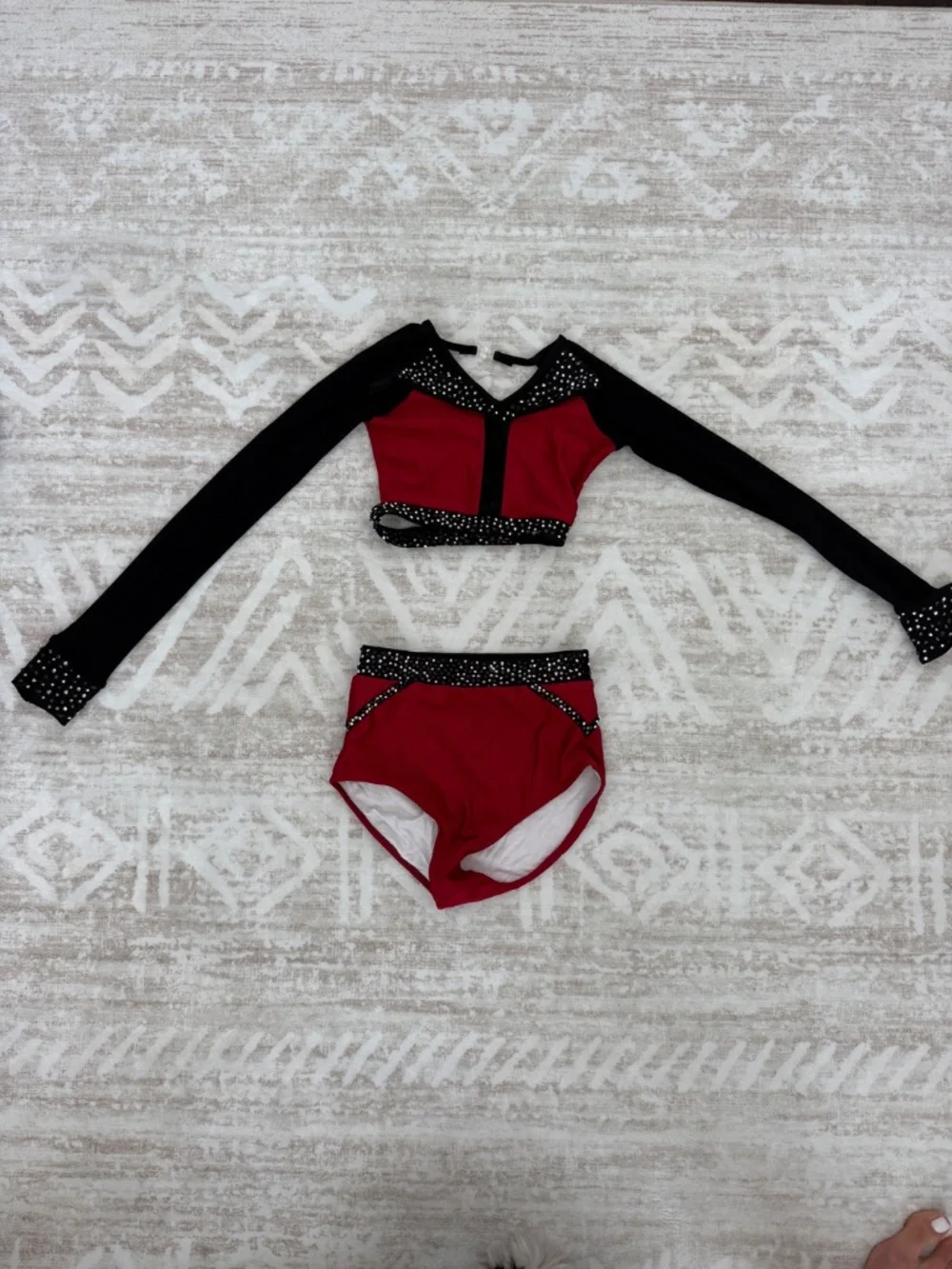 Jazzy red and black two-piece costume. bedazzled.